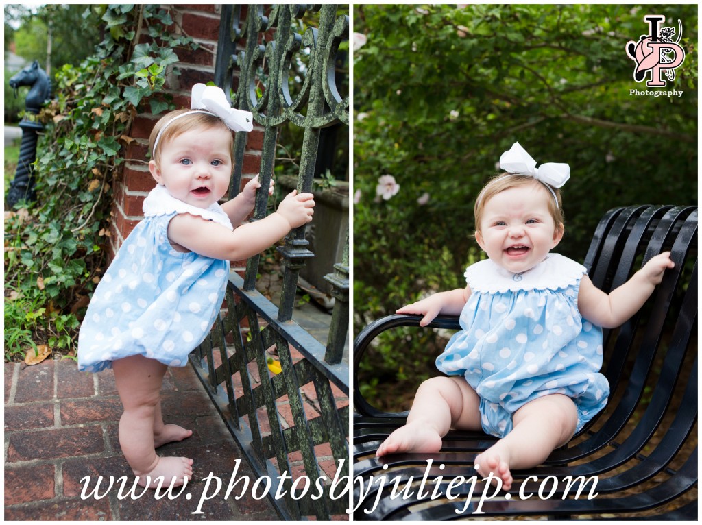 Baby girl standing by iron gate