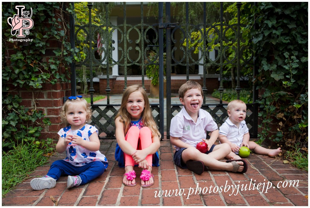 children in front of iron gate