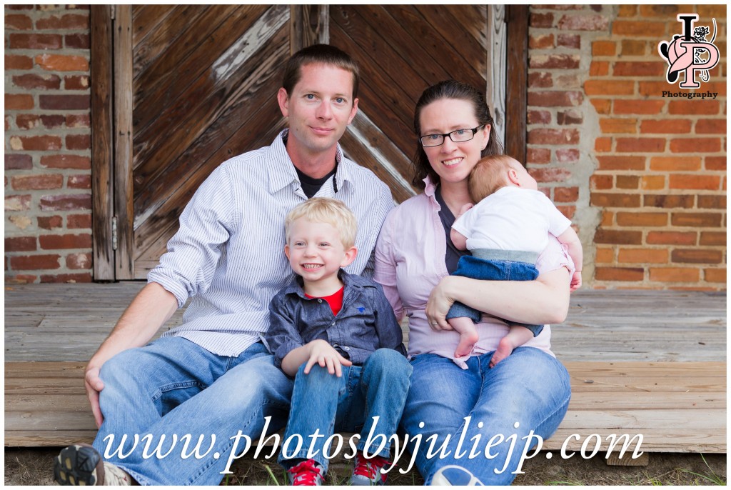 family in front of barn