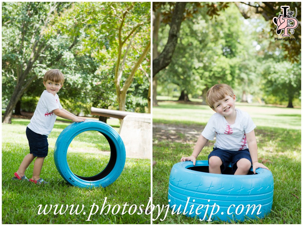 Young boy playing with blue tire