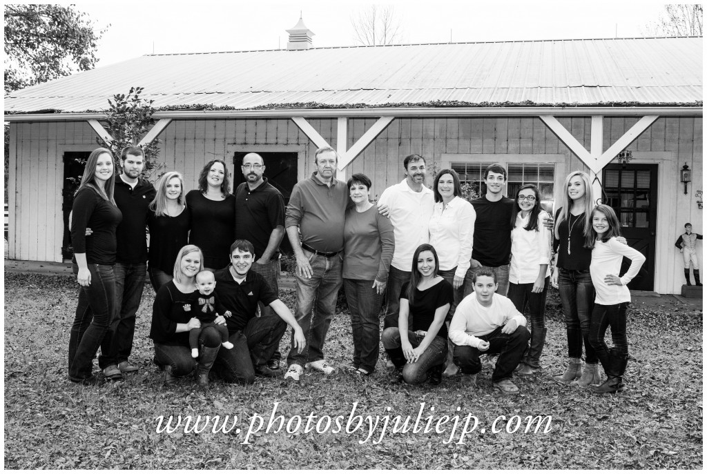 family portrait in front of barn