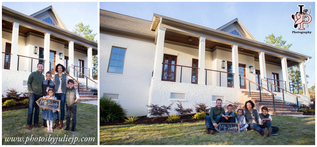 family portrait in front of new house